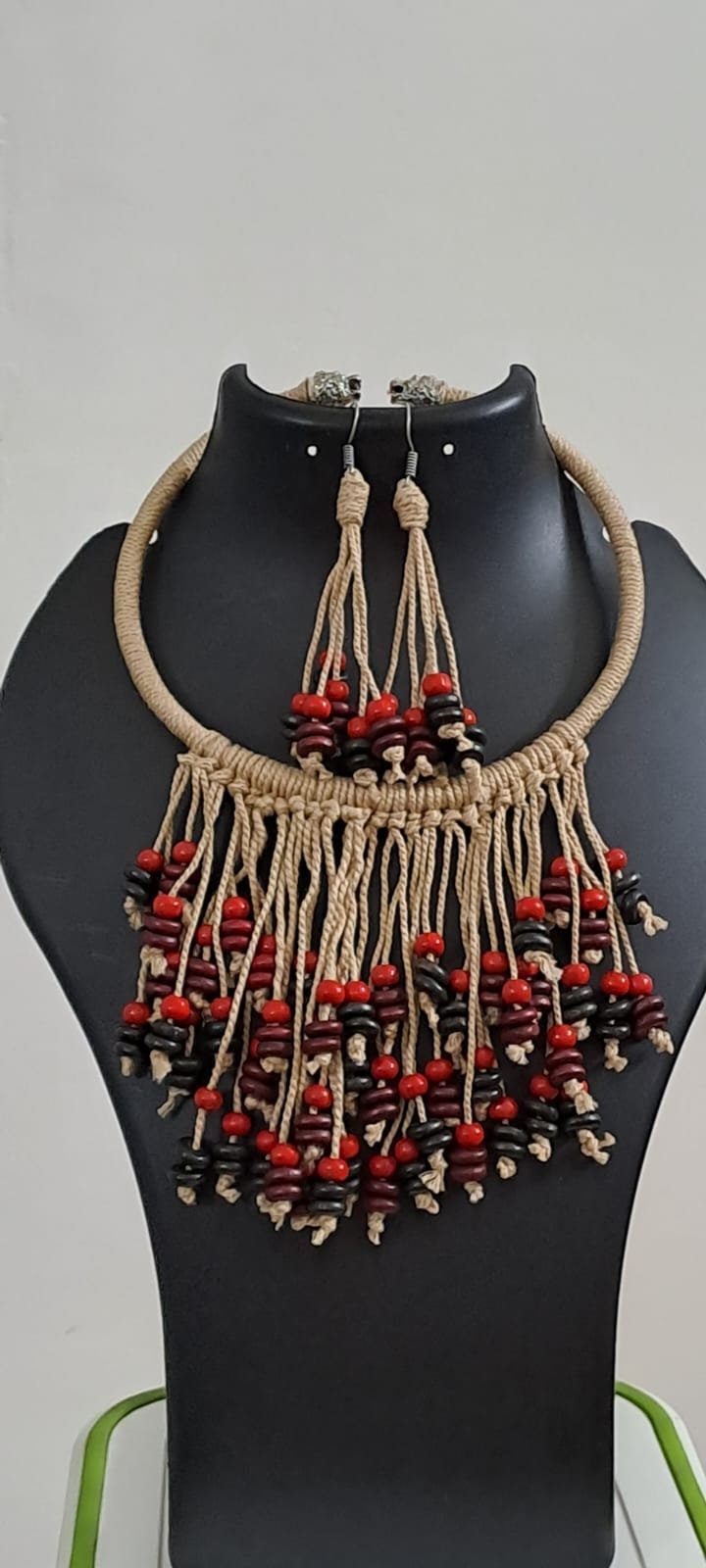 Exclusive beige thread neckband with fringes and matching earrings.
