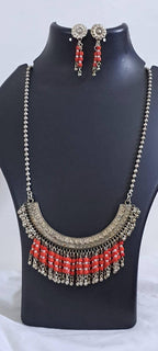 Exclusive necklace with silver oxidised big oval pendant with glass beads fringes and matching earrings.