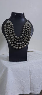 Multi-layered silver oxidised beads necklace .