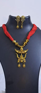 Red thread necklace with golden oxidised pendant