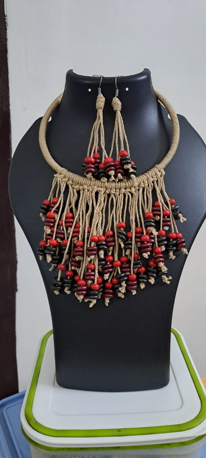 Exclusive beige thread neckband with fringes and matching earrings.