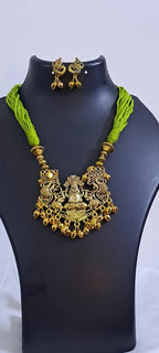 Light green thread necklace with Golden oxidised traditional pendant