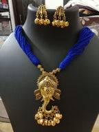 Oxidised golden ganesha traditional pendant and matching earrings.