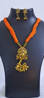 Orange thread necklace with Golden oxidised traditional pendant