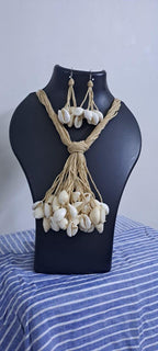 Multi layered jute necklace with shell fringes and with matching earrings.