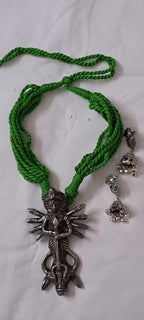 Green thread necklace with oxidised silver durga pendant