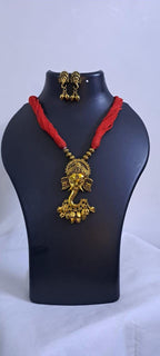 Red thread necklace with Golden oxidised traditional pendant