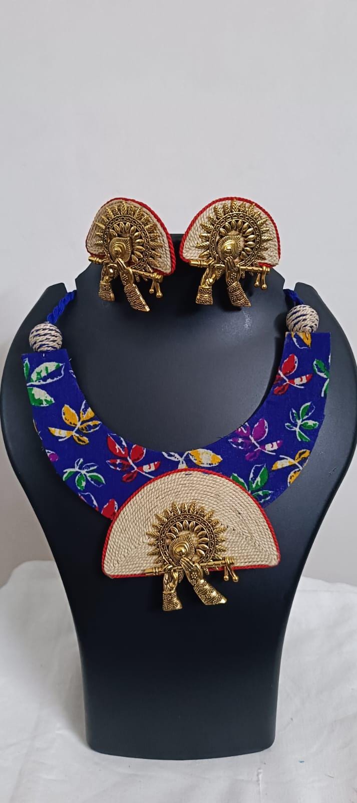 Unique fabric n thread necklace set with golden oxidised pendant and matching earrings