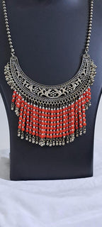Exclusive necklace with silver oxidised big oval pendant with glass beads fringes and matching earrings.