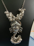 Oxidised silver chain with traditional pendant and matching earrings.