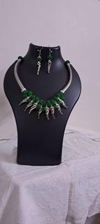 Green thread necklace with kolhapuri silver oxidised traditional beads and matching earrings