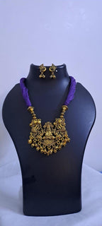 Purple thread necklace with Golden oxidised traditional pendant