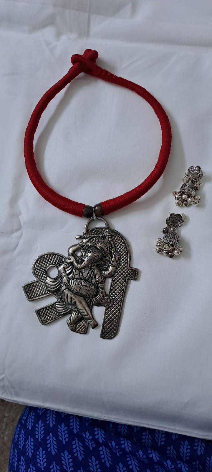 Red thread necklace with silver oxidised ganesha pendant