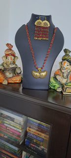 Red beads necklace with golden oxidised pendant