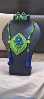 Thread necklace depicting peacock feather with shades of green. Exclusively for Janmashtami