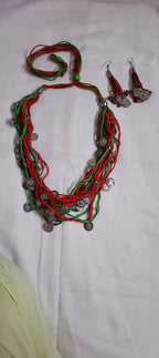 Exclusive multi-coloured and multi-layered thread necklace with silver oxidised charms