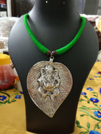 Green thread necklace with silver oxidised ganesha pendant
