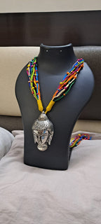 Multi coloured thread necklace with oxidised silver buddha pendant