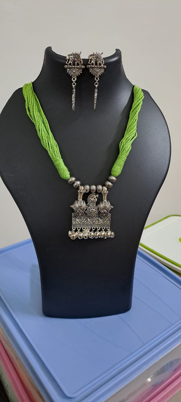 Light green thread necklace with silver oxidised traditional pendant