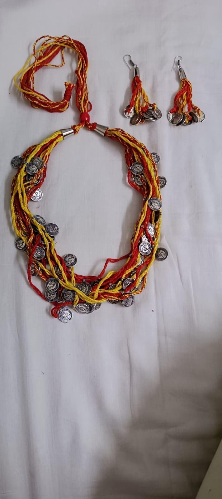 Exclusive multi-coloured and multi-layered thread necklace with silver oxidised charms