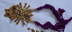 Purple thread necklace with oxidised golden durga pendant