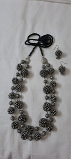 Exclusive silver oxidised long chain set with matching earrings