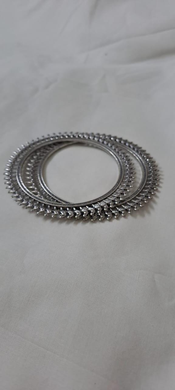 Traditional silver oxidised bangles with birds border.