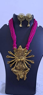 Pink thread necklace with oxidised golden durga pendant