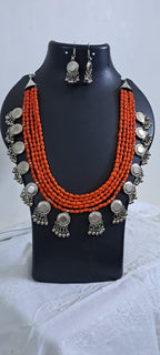 Exclusive multi layered  orange glass beads necklace set with silver oxidised charms n matching earrings