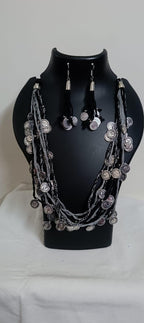 Exclusive multi-coloured and multi-layered thread necklace with silver oxidised charms