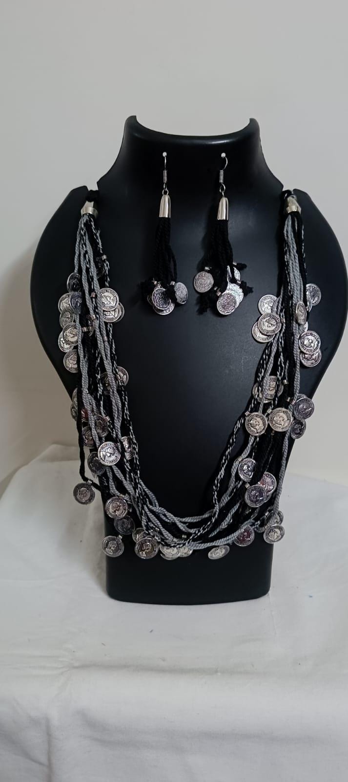 Exclusive multi-coloured and multi-layered thread necklace with silver oxidised charms