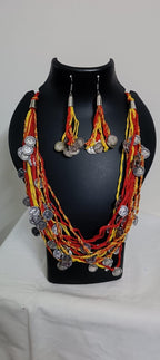 Exclusive multi-coloured and multi-layered thread necklace with silver oxidised charms