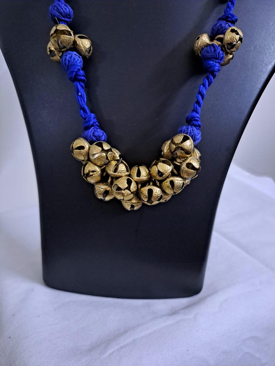 Blue thread necklace with trinkets n matching earrings