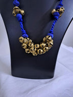 Blue thread necklace with trinkets n matching earrings