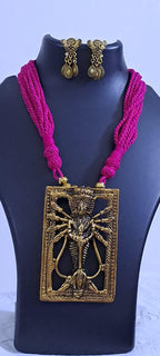 Pink thread necklace with oxidised golden durga pendant