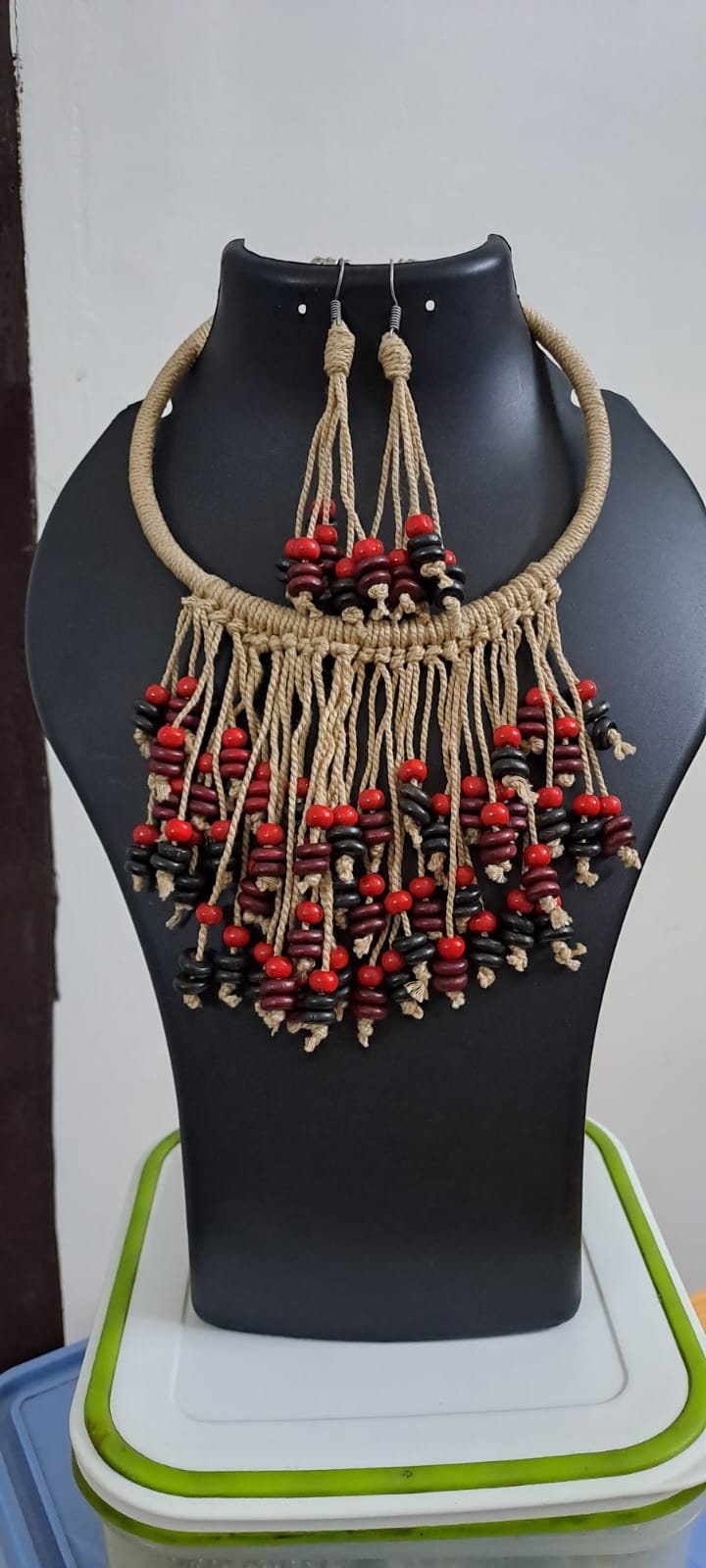 Exclusive beige thread neckband with fringes and matching earrings.