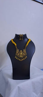 Yellow thread necklace with Golden oxidised traditional pendant