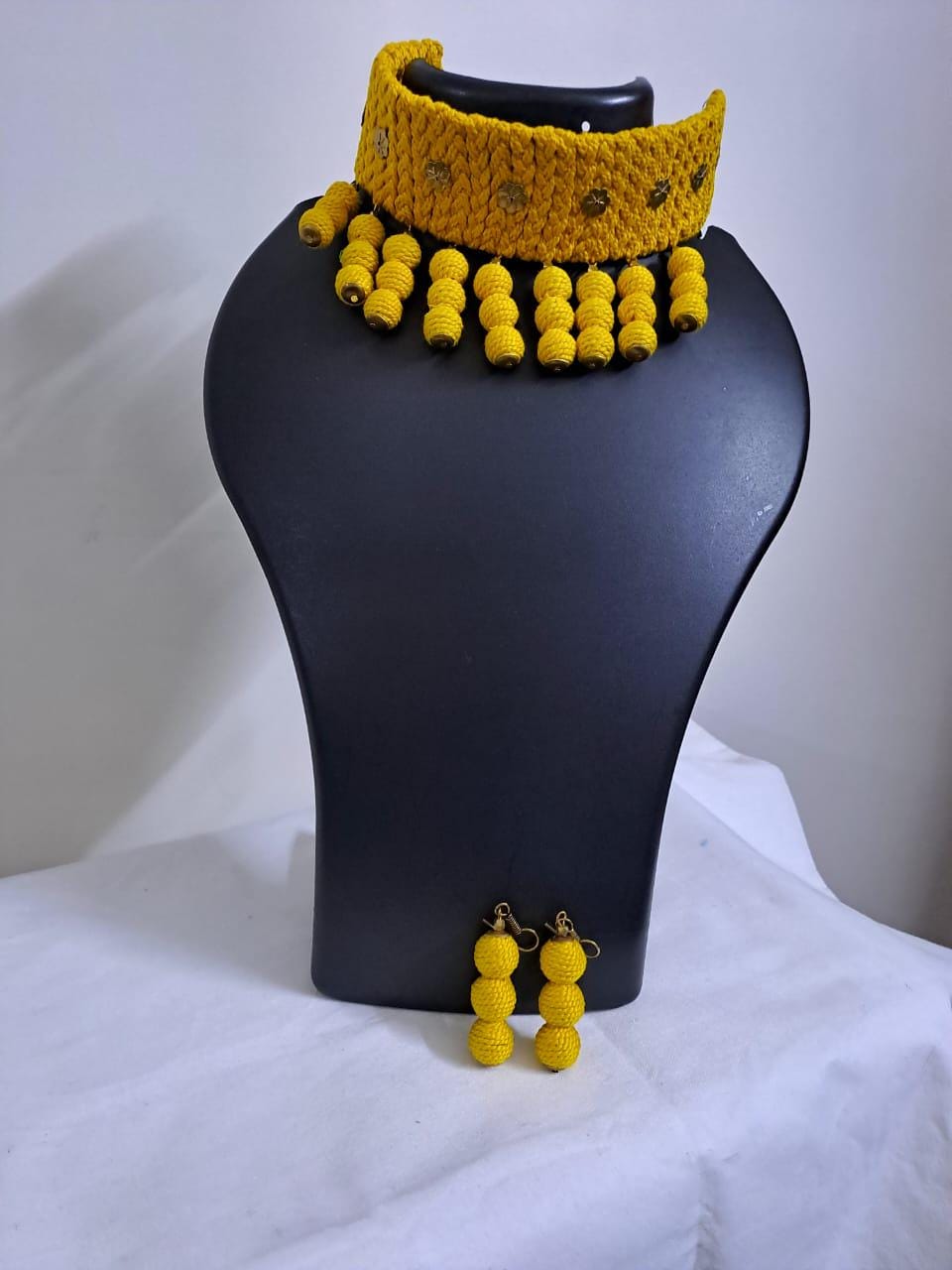 Yellow braided choker necklace set with fringes and matching earrings