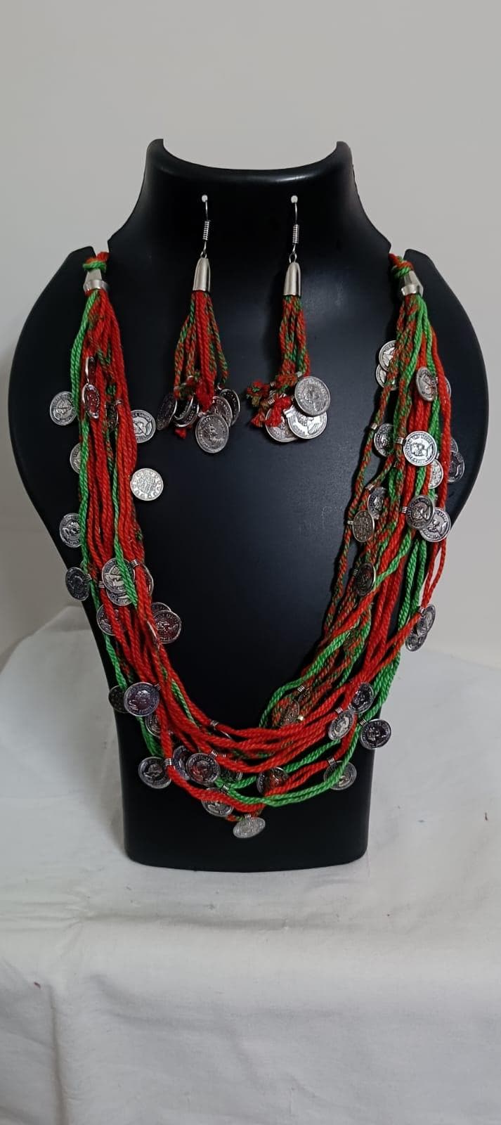 Exclusive multi-coloured and multi-layered thread necklace with silver oxidised charms