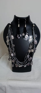 Exclusive multi-coloured and multi-layered thread necklace with silver oxidised charms