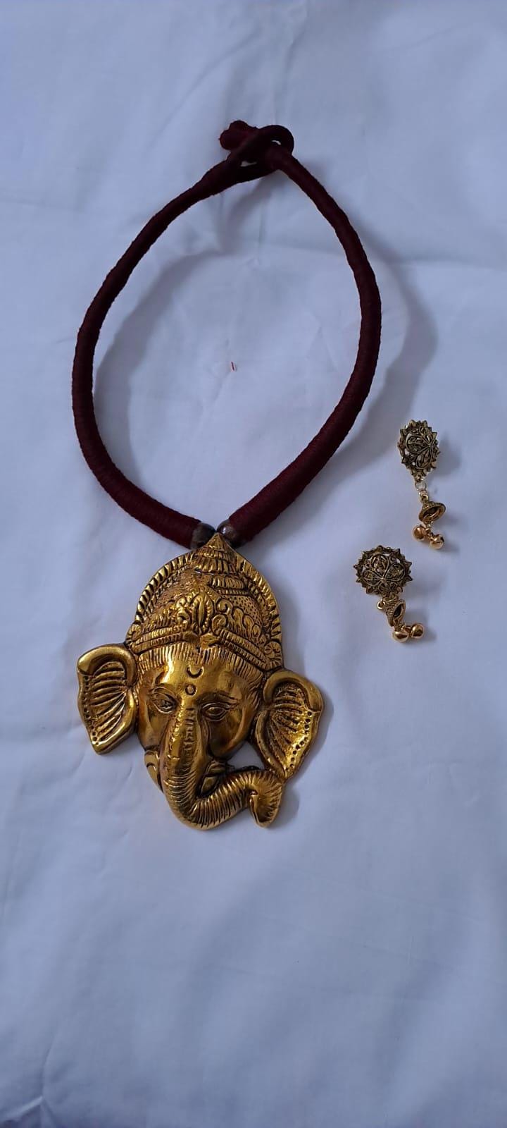 Maroon thread necklace with golden oxidised ganesha pendant