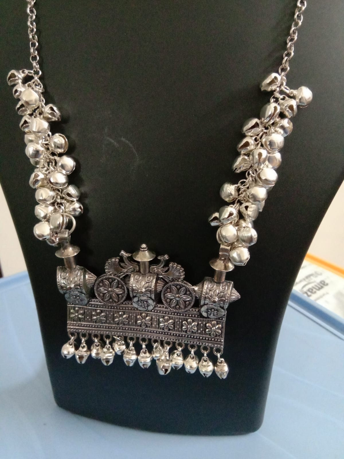 Oxidised silver chain with traditional pendant and matching earrings.